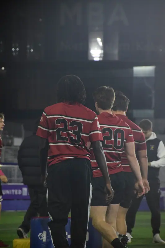 Loyola jerseys walking under the lights