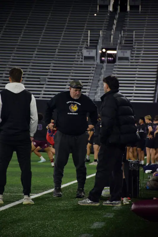 Loyola coaches and players on the sideline